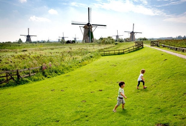 Amsterdam is famous for windmills, cheese, flowers, and canals. Photo courtesy of Stichting Werederfgoed Kinderdjik