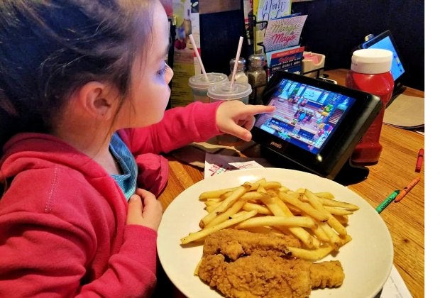 Keep the kids busy at Applebee's with games on a tableside tablet. Photo by Anne Caminiti - Momee Friends of Long Island www.momeefriendsli.com