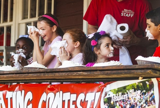 Enjoy live entertainment, family-friendly activities, and luscious strawberry-themed food and drink specials at Peddler's Village Strawberry Festival. Photo by Paul Boger