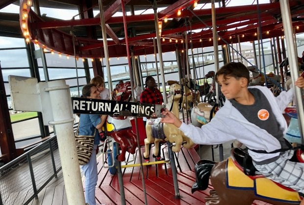 Grab the brass ring and get a free ride at Greenport's carousel. Photo by Jaime Sumersille