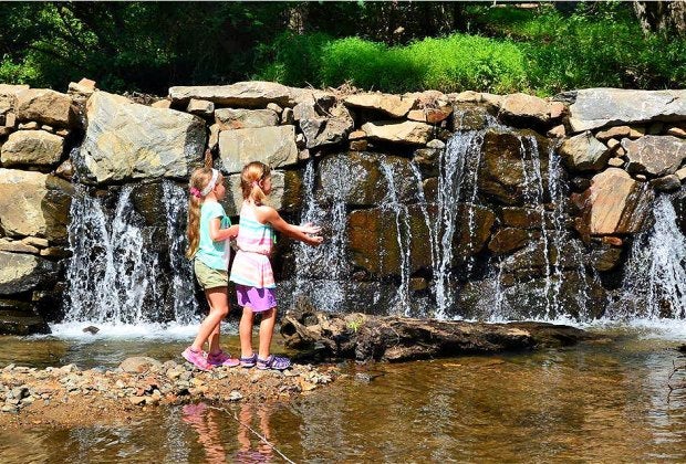 Delight in the calming waters of the mini-waterfall.