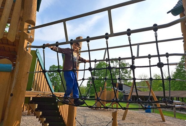 Balance on the wobbly bridge at Freedom Park in Lagrangeville.