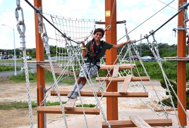 Climb the ropes and ladder courses at WildPlay Jones Beach—if you dare. 