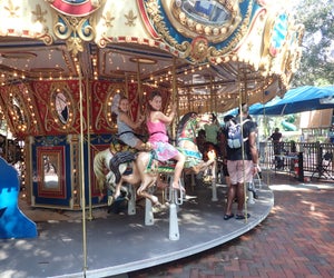 Riding the carousel at Sugar Sand Park, photo by the author