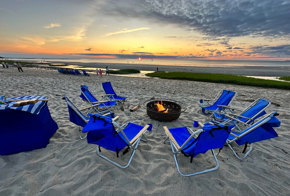 Enjoy s'mores at a fire pit on the private beach as the sun sets!