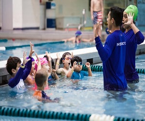 Kids can jump right into learning with swim lessons at Asphalt Green's two locations. Photo courtesy of the venue