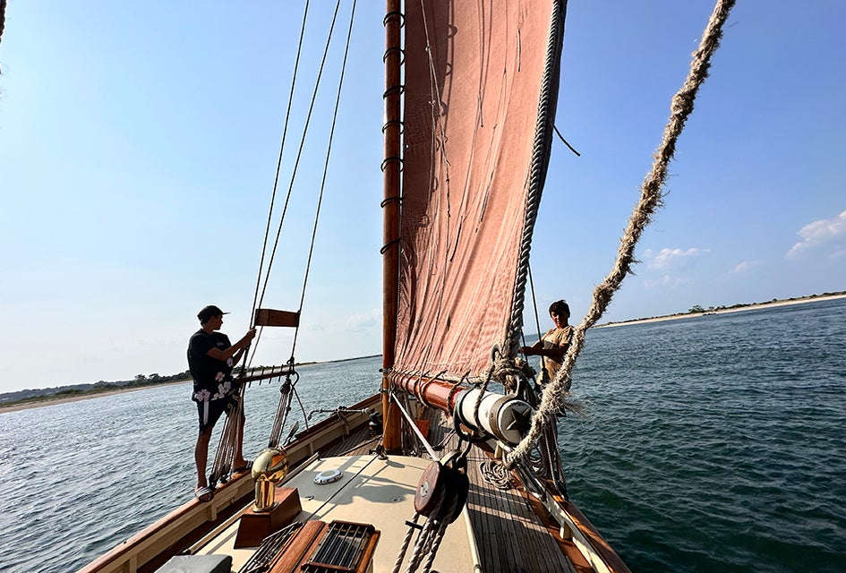 Take in the gorgeous views as you learn to hoist the sails. 