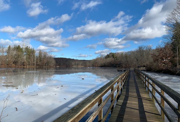 Traverse the bridge across Teatown Lake during your hike.