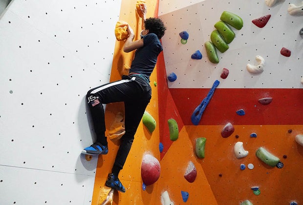 teenager rocking climbing indoors The Cliffs at Harlem