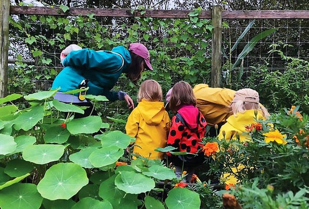 Small children look at the garden at the Queens County Farm Museum