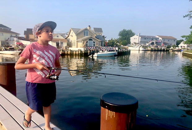 kids fishing off a pier