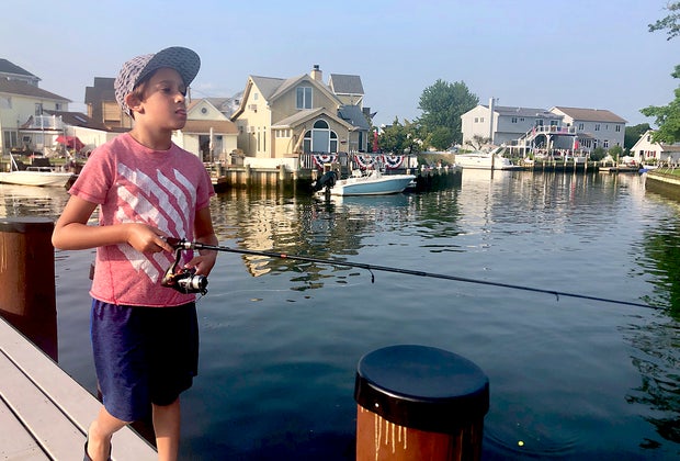 kids fishing off a pier