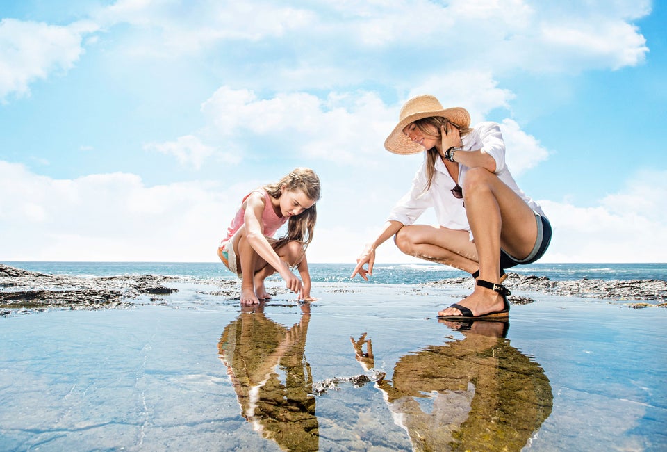 She finds sea urchins by the sea shore. Photo courtesy of VisitLagunaBeach.com