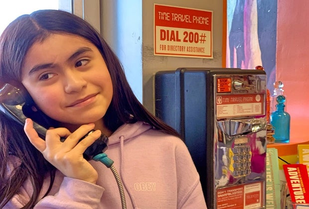 Making a call on the Time Travel Phone at the Time Travel Mart