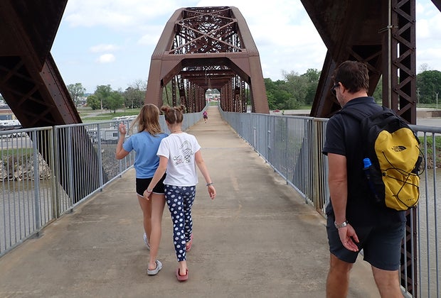 Family walks across the Clinton Bridge: Little Rock with Kids: