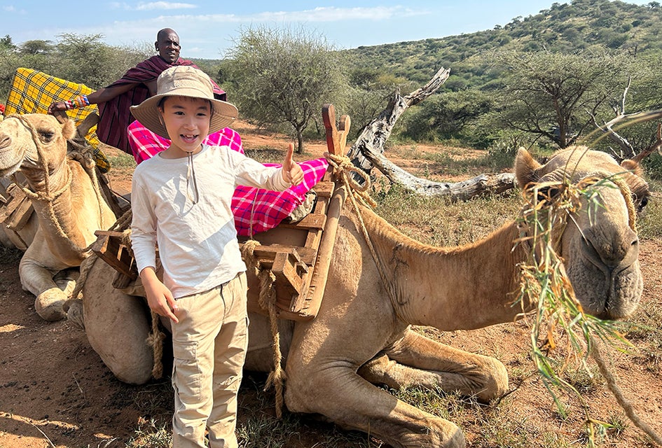Embrace the slow rhythm of a camel ride on a safari adventure. Photo by Diana Kim