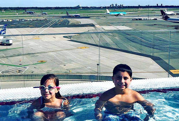 Cool hotel pools in New York: Two kids in the pool at the TWA Hotel