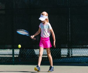 Kids learn the fundamentals and more at a South Florida tennis camp.