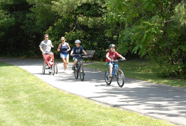 family biking on path Westchester North County Trail 