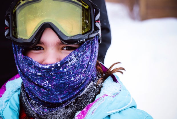 Masks up and jackets zipped! Make sure kids have proper layers for skiing.