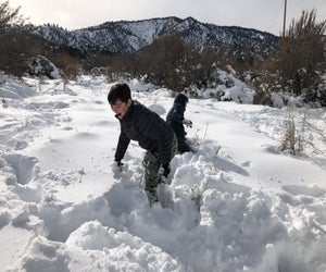 Visit Wrightwood and let your SoCal kids play in piles of pristine snow. Photo courtesy of Mommy Poppins