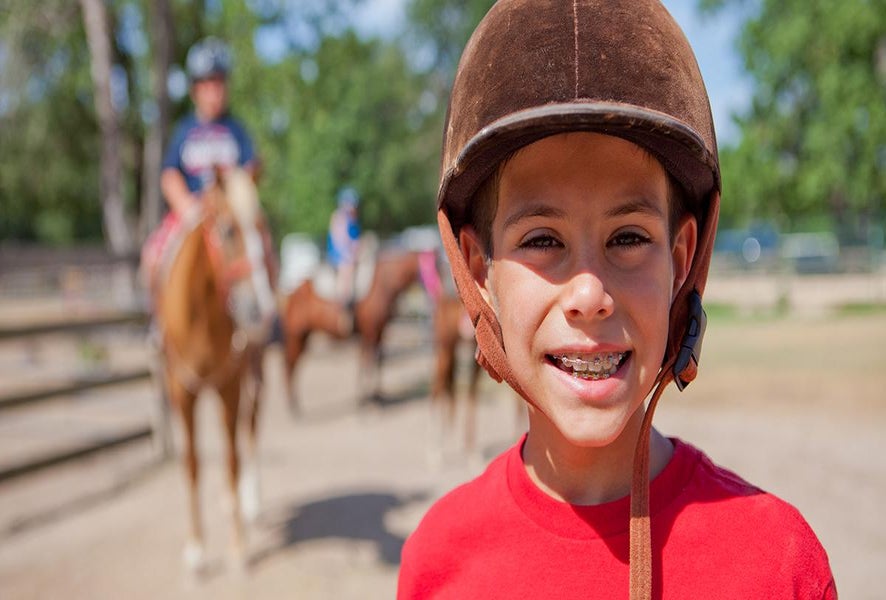 Horseback riding is a favorite kid activity in Conroe